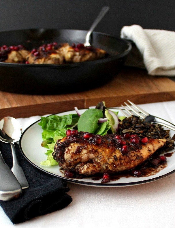Pomegranate-Cranberry Chicken - Tender cooked chicken breasts topped with a sweet and spicy pomegranate-cranberry sauce with just the right touch of heat.