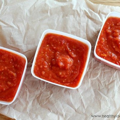 Three freezer containers of tomato sauce