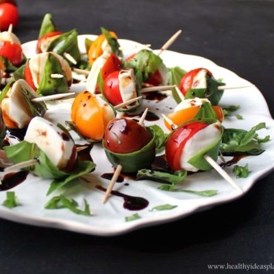 closeup of Caprese Bites with Balsamic Drizzle on a white plate
