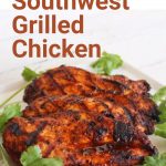 Grilled chicken and fresh cilantro on white plate