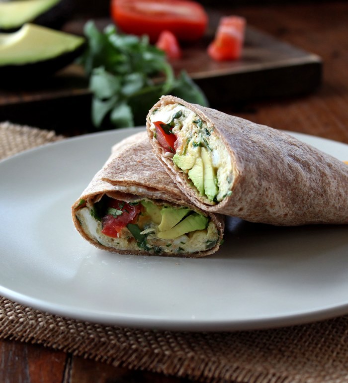 Breakfast Burrito with Eggs, Tomato, and Avocado makes a healthy and satisfying breakfast filled with high quality protein, healthy fats, and tasty veggies.