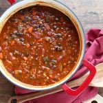 Overhead view of Vegetarian Chili with Red Lentils in a Dutch oven