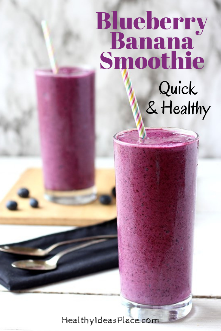 Blueberry banana smoothies in clear glass with straw